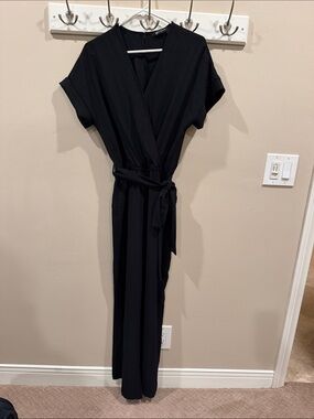 PrettyGarden Black Faux Wrap Wide Leg Jumpsuit Size S  Pockets and a Tie Waist